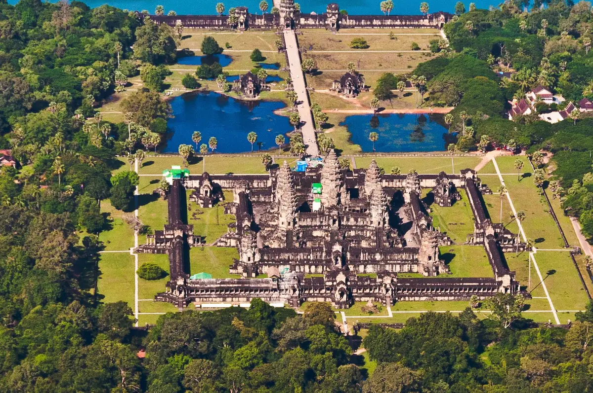 Aerial view of Angkor Wat with its moat, causeway and the five towers inside the square enclosure, seen on Angkor Wat tours from Siem Reap