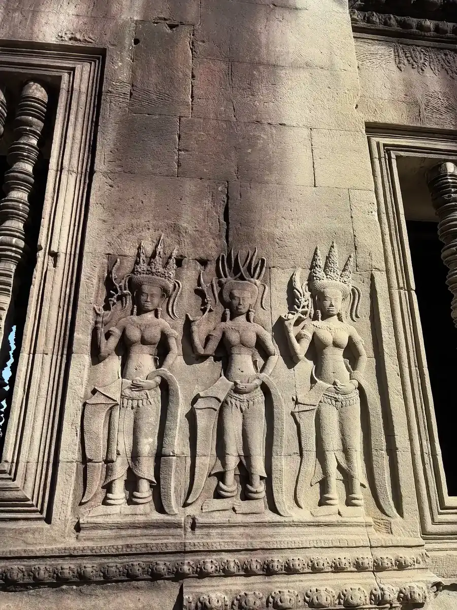 Apsara (celestial dancer) carvings on the sandstone wall of Angkor Wat, seen on Angkor Wat tours from Siem Reap