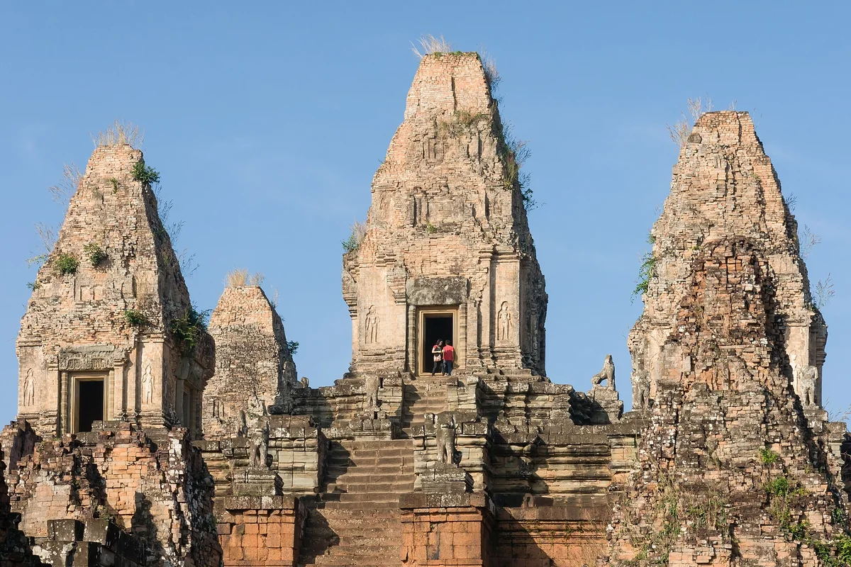 The brick-and-laterite central towers of Pre Rup temple mountain against a blue sky, seen on Angkor Wat tours from Siem Reap